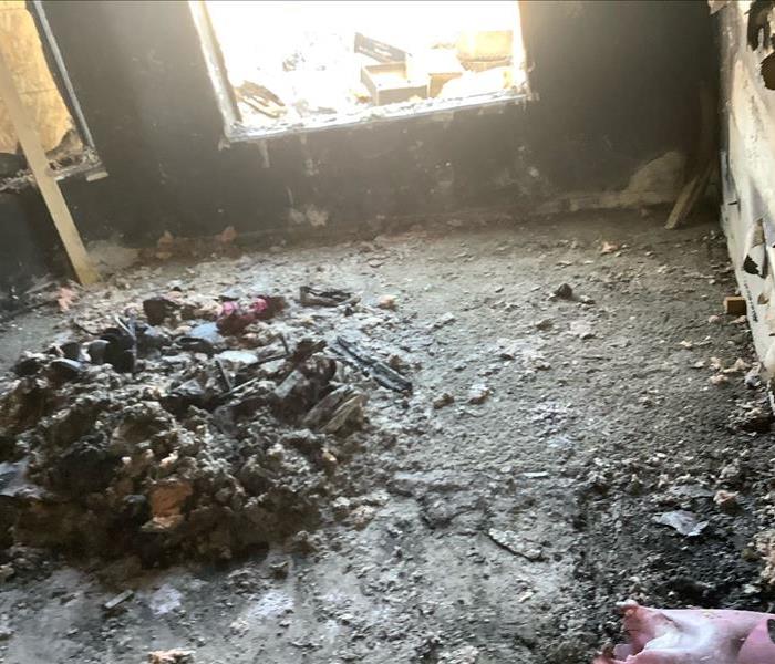 Bedroom where fire started before clean up