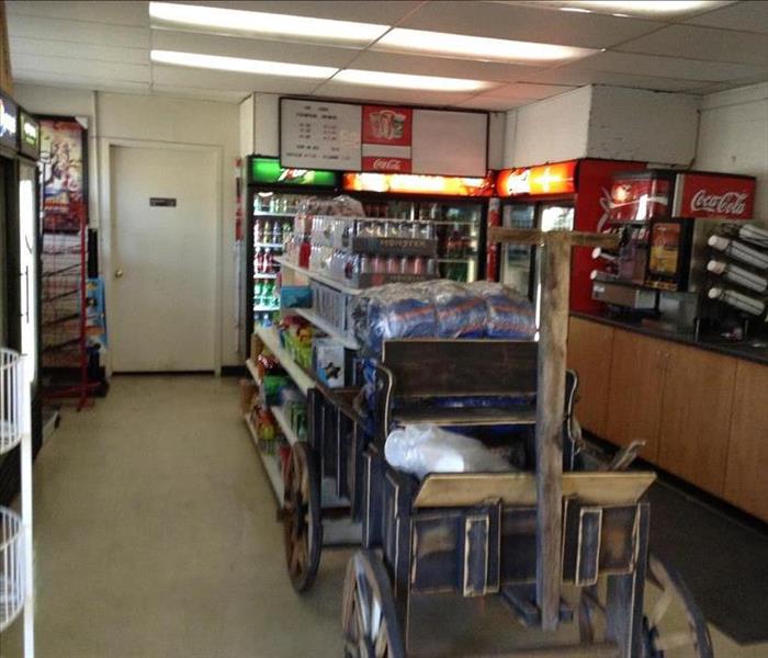 The inside of a gas station convenience store looking towards the guest bathroom.