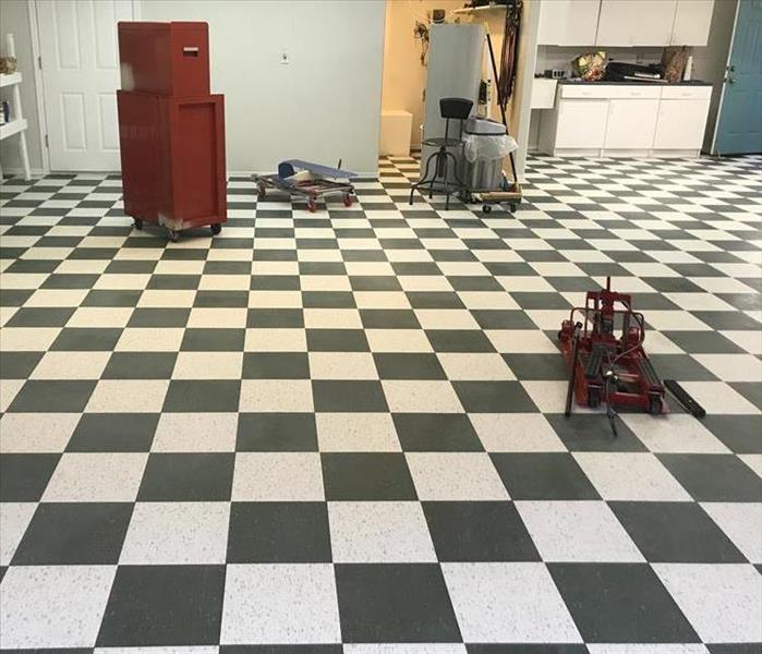 Local Mechanic gets his floors restored by SERVPRO