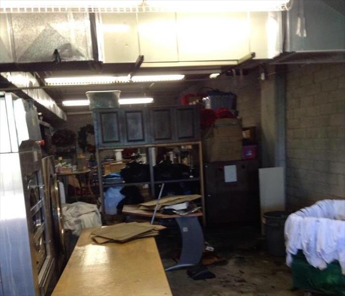 supply room of a commercial building that had a fire started by an industrial dryer. Created smoke damage