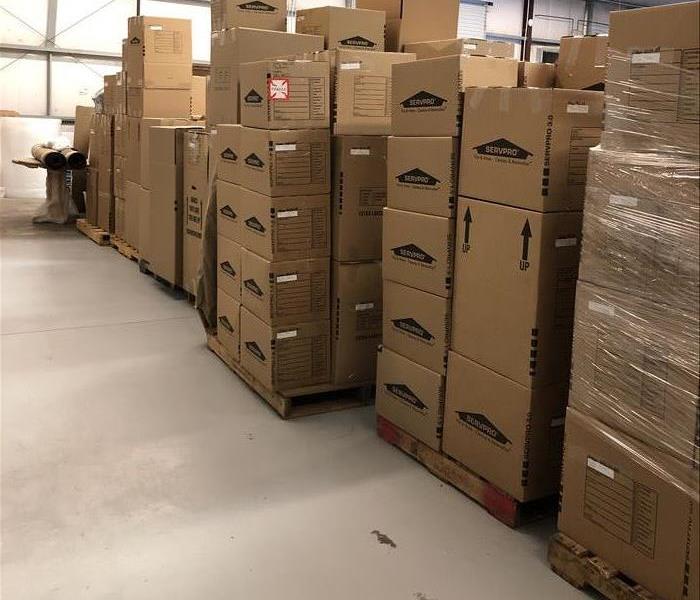 SERVPRO contents enclosed  warehouse with stacked SERVPRO boxes filled with customer contents 