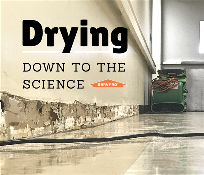 drying equipment in a affected room with a written slogan "Drying down to a science"