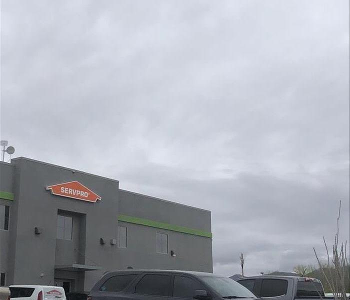 SERVPRO building with gray storm clouds moving in